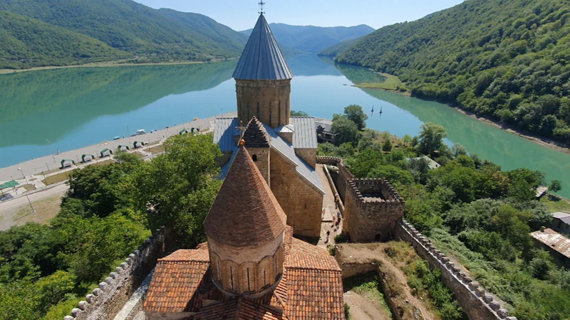 Ananuri Fortress beside a turquoise reservoir