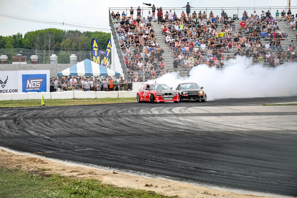 red and white racing car on track during daytime