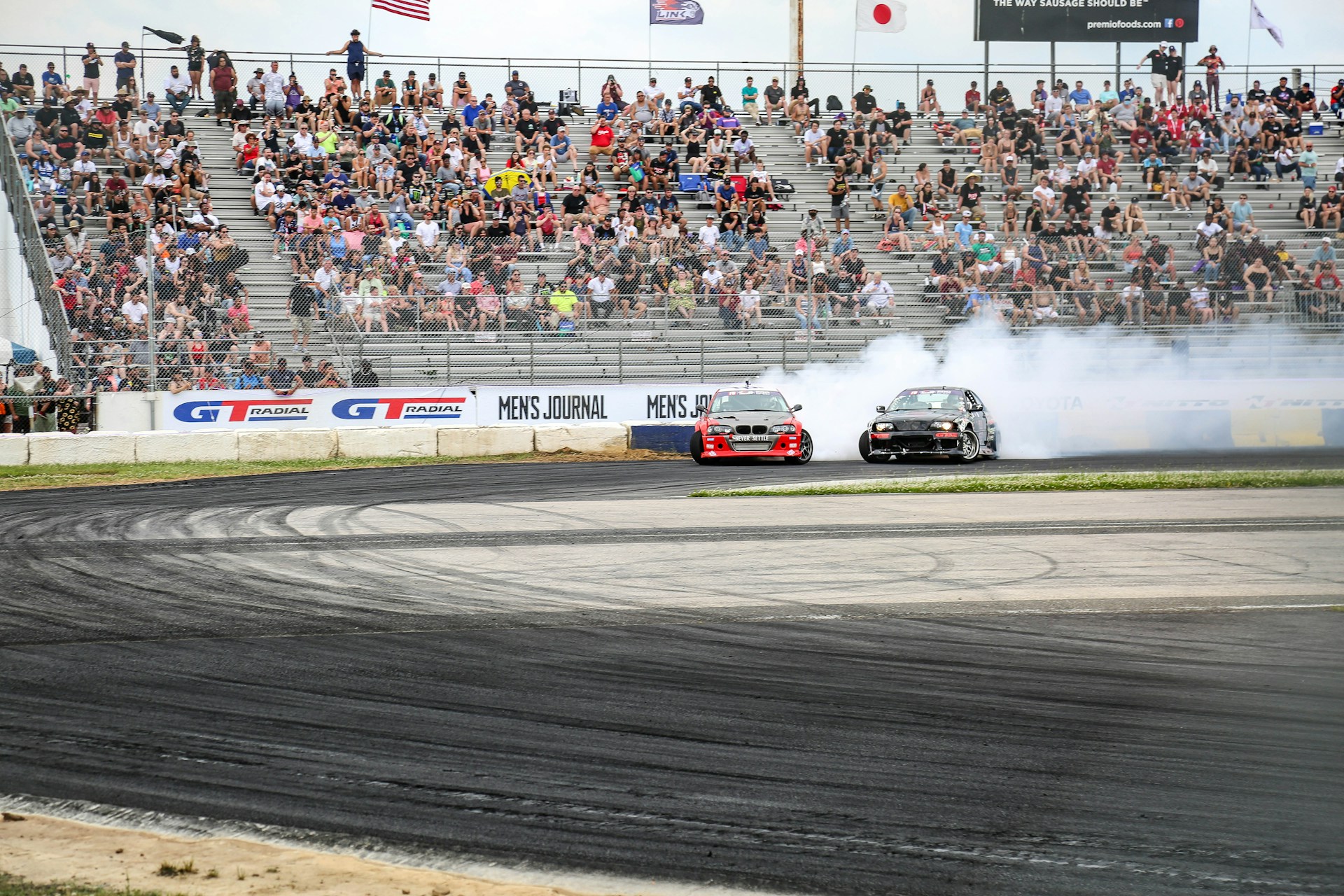 white and red racing car on track during daytime
