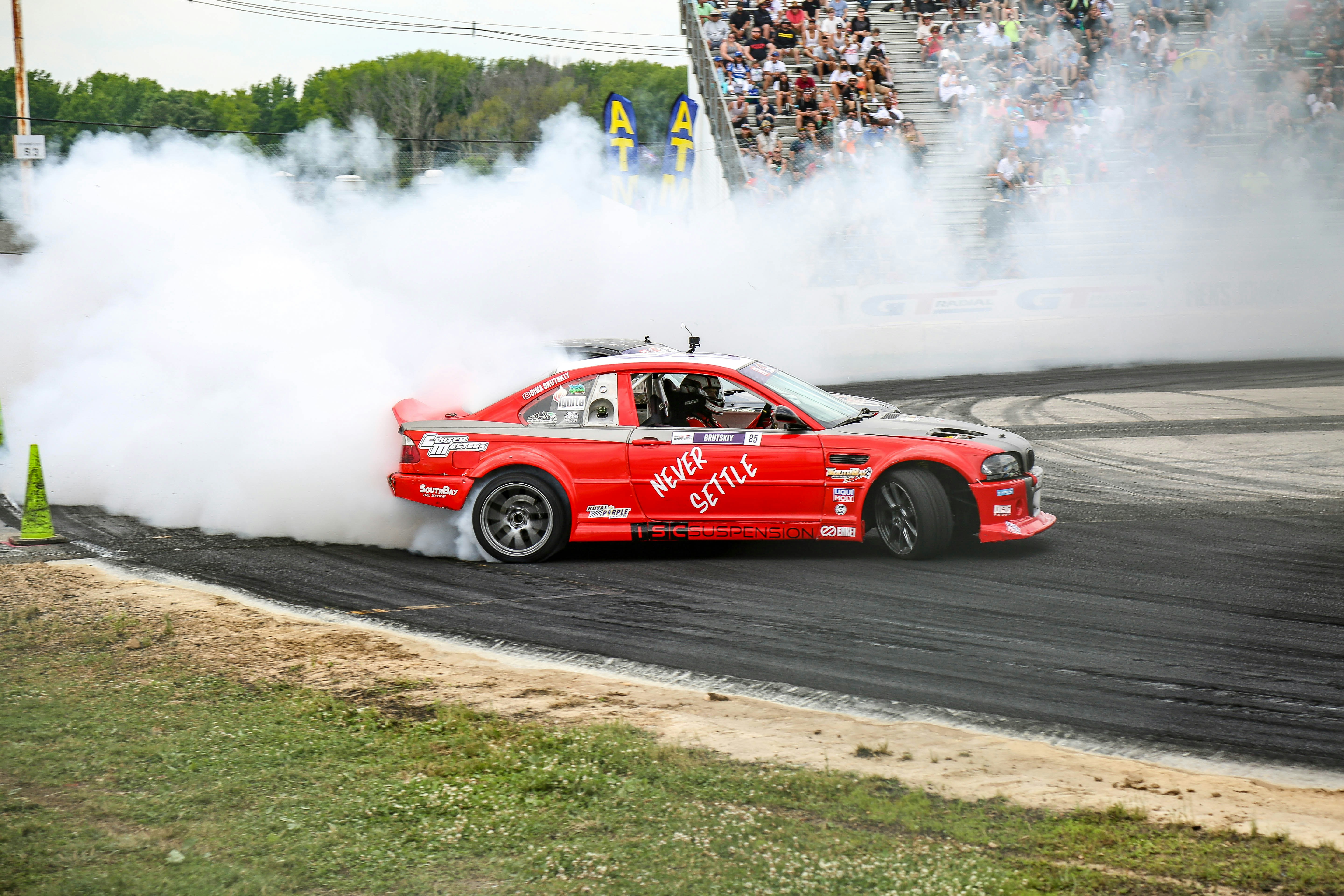 red and white ferrari f 1 on track
