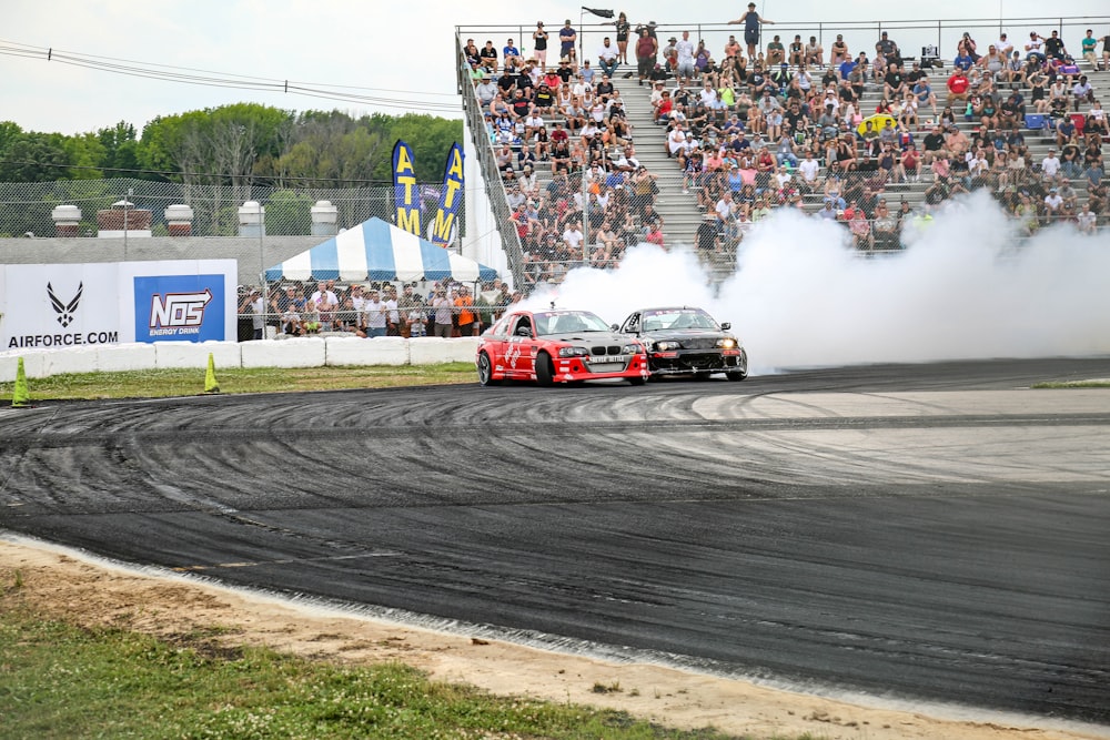 red and white racing car on track during daytime