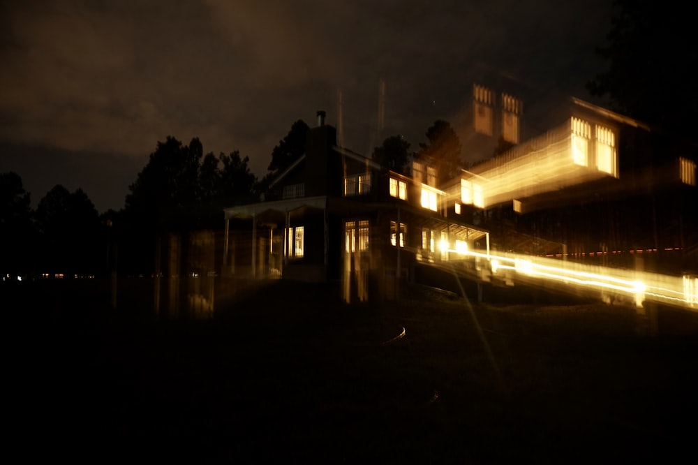 white and brown wooden house during night time