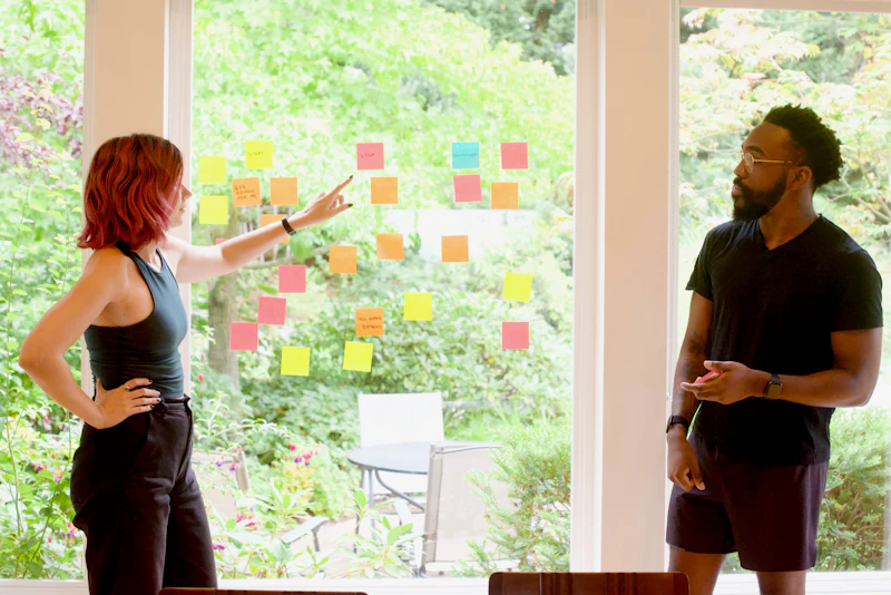 Woman brainstorming at a whiteboard