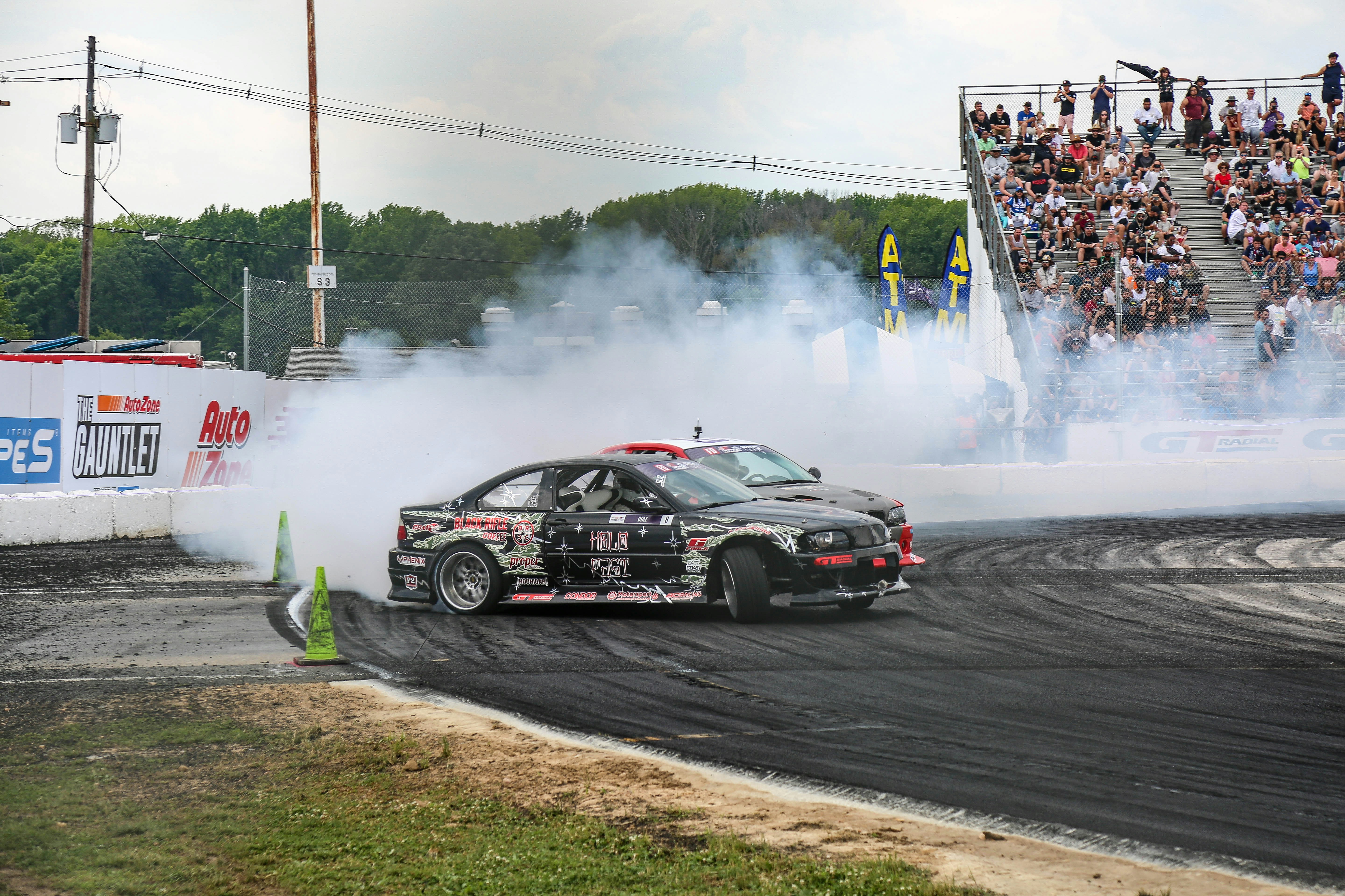black and red sports car on road
