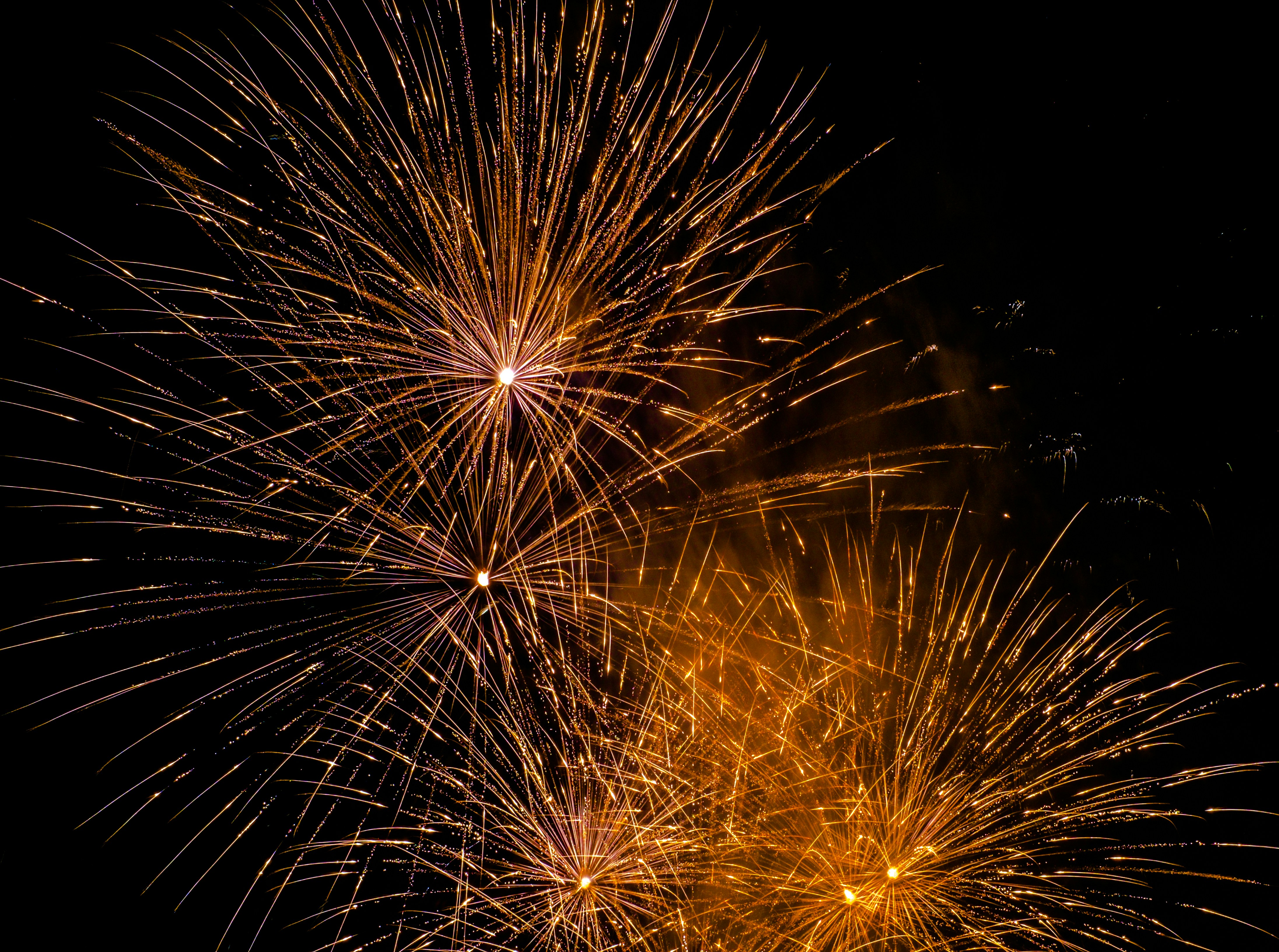 yellow fireworks in the sky during nighttime