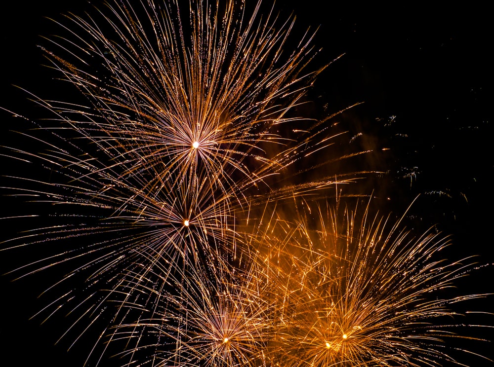 yellow fireworks in the sky during nighttime