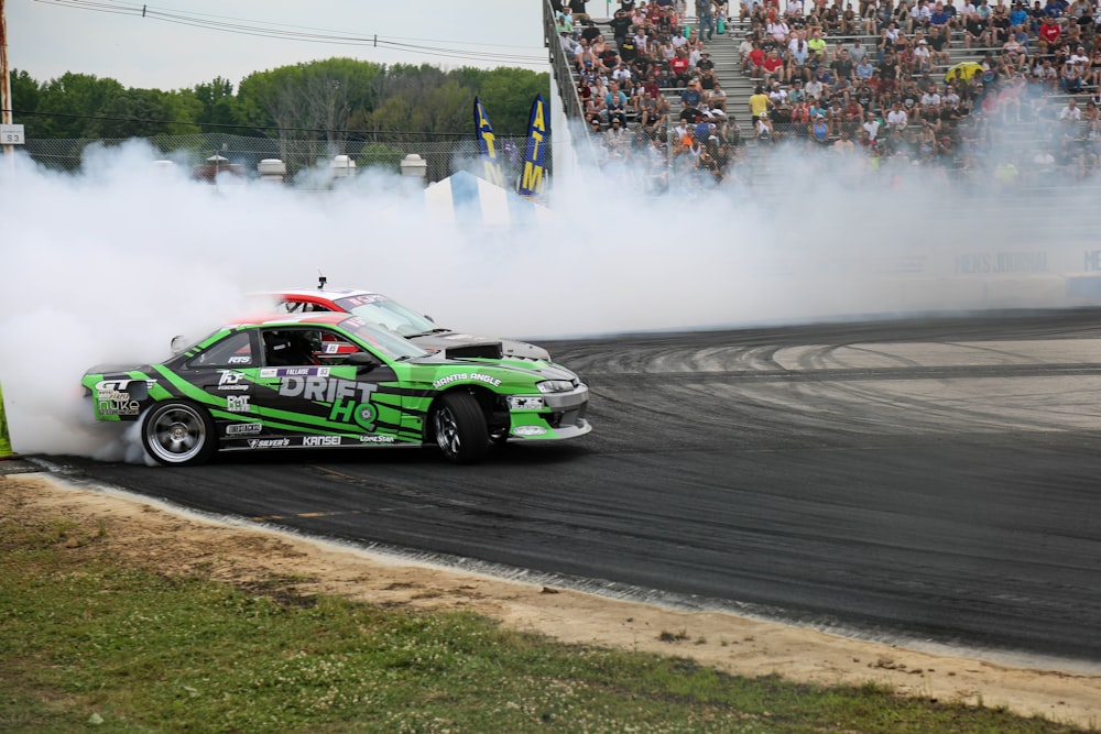 green and black racing car on track