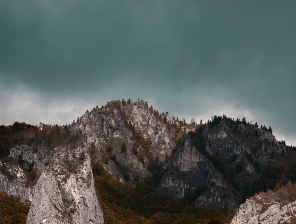 gray rocky mountain under gray sky