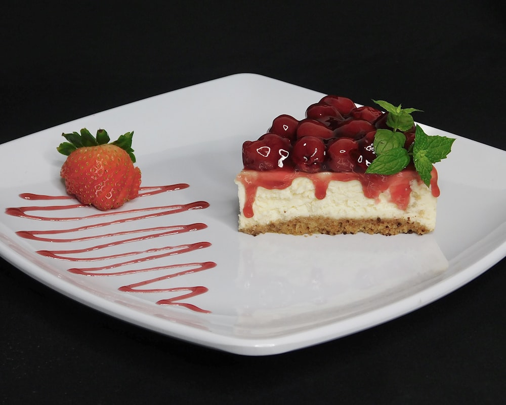 strawberry cake on white ceramic plate