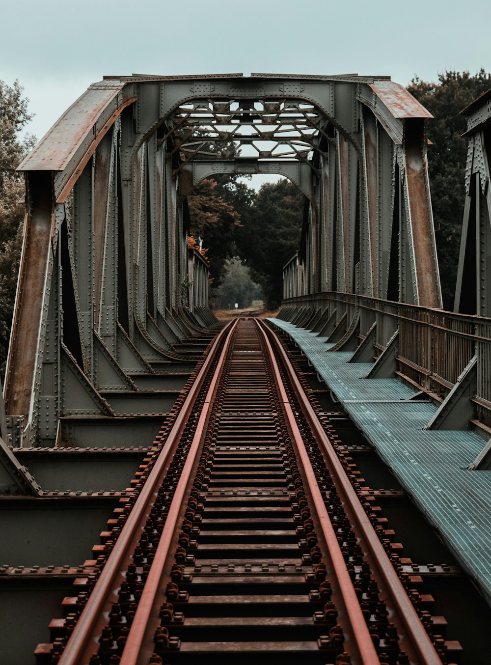 red and gray metal train rail