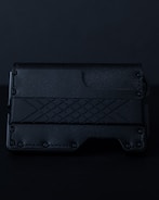 Leather wallet featuring detailed engraved designs.