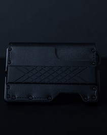 A stylish leather wallet in matte black with a red stitching detail on a white background.