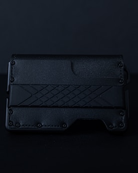 A sleek leather wallet featuring a crisp, laser-engraved monogram.