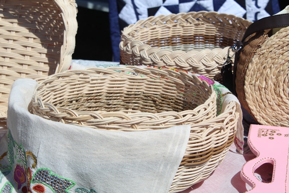 brown woven basket on gray textile