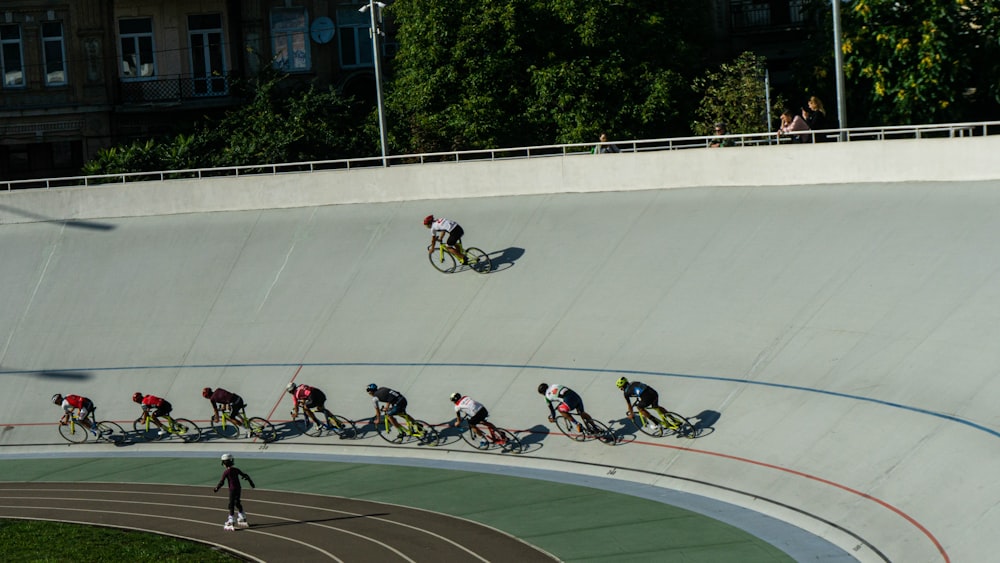 people riding on bicycle racing during daytime