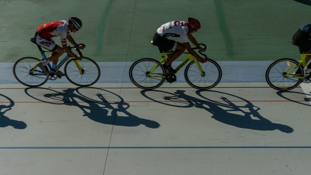 man in white and red shirt riding bicycle