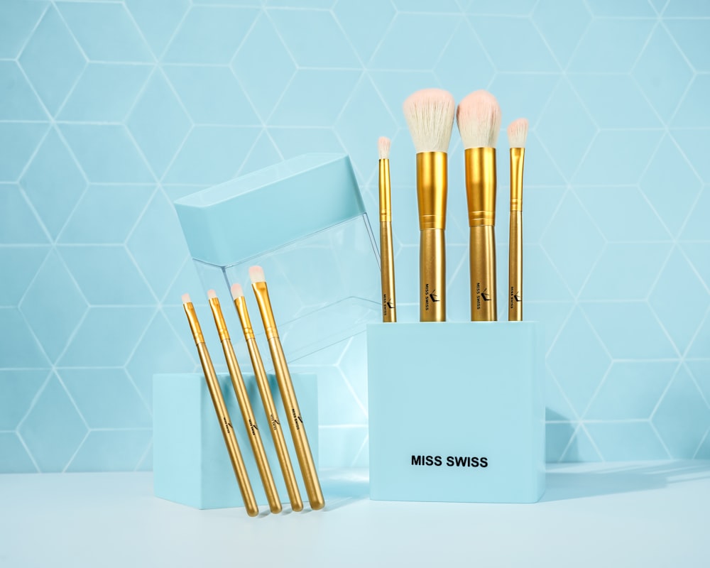 a set of makeup brushes in a blue box