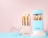 A set of golden-handled makeup brushes displayed in stylish white and blue holders with the brand name 'MISS SWISS'. The brushes have soft, white bristles and are neatly arranged in the containers on a pastel-colored background.