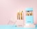 A set of golden-handled makeup brushes displayed in stylish white and blue holders with the brand name 'MISS SWISS'. The brushes have soft, white bristles and are neatly arranged in the containers on a pastel-colored background.