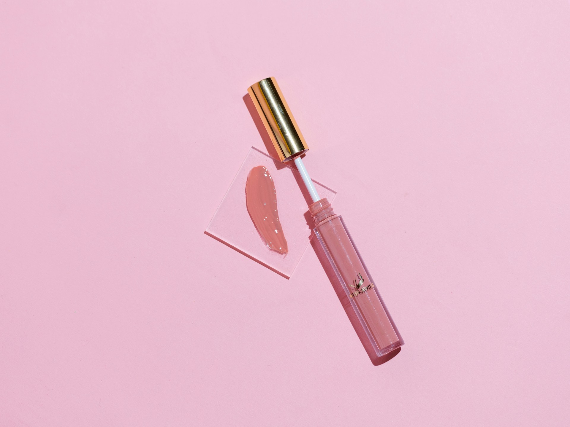 pink lipstick on pink surface