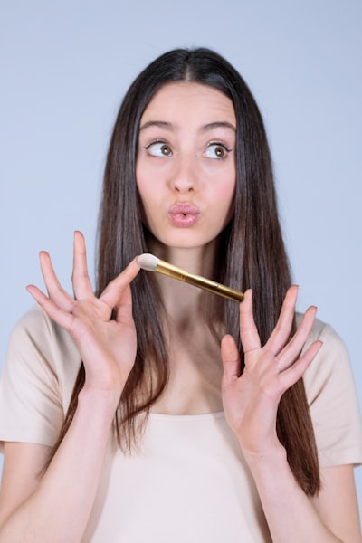 Girl holding foundation brush