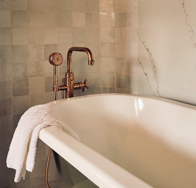 Cozy bathroom upgrade featuring a freestanding tub and elegant tile work.