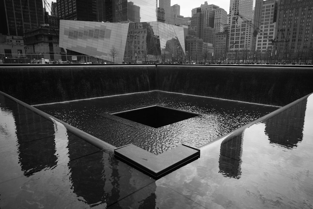 grayscale photo of water fountain