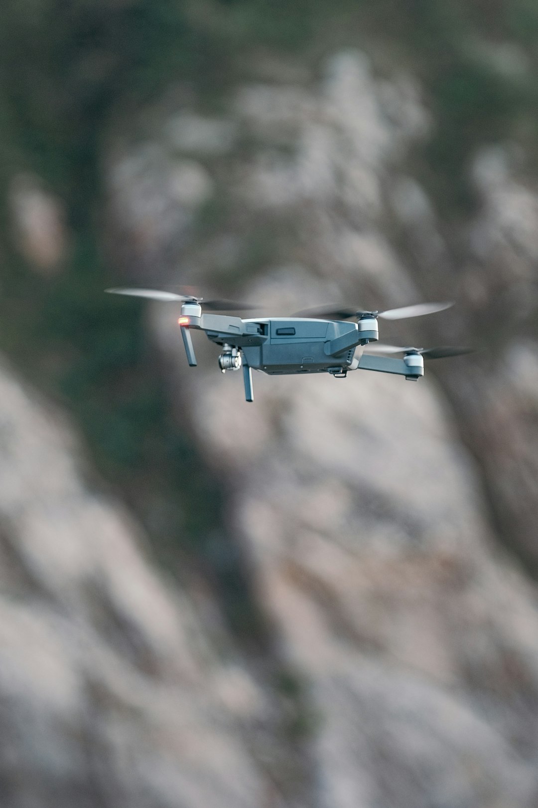 gray drone flying during daytime