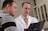 man in white dress shirt holding black tablet computer