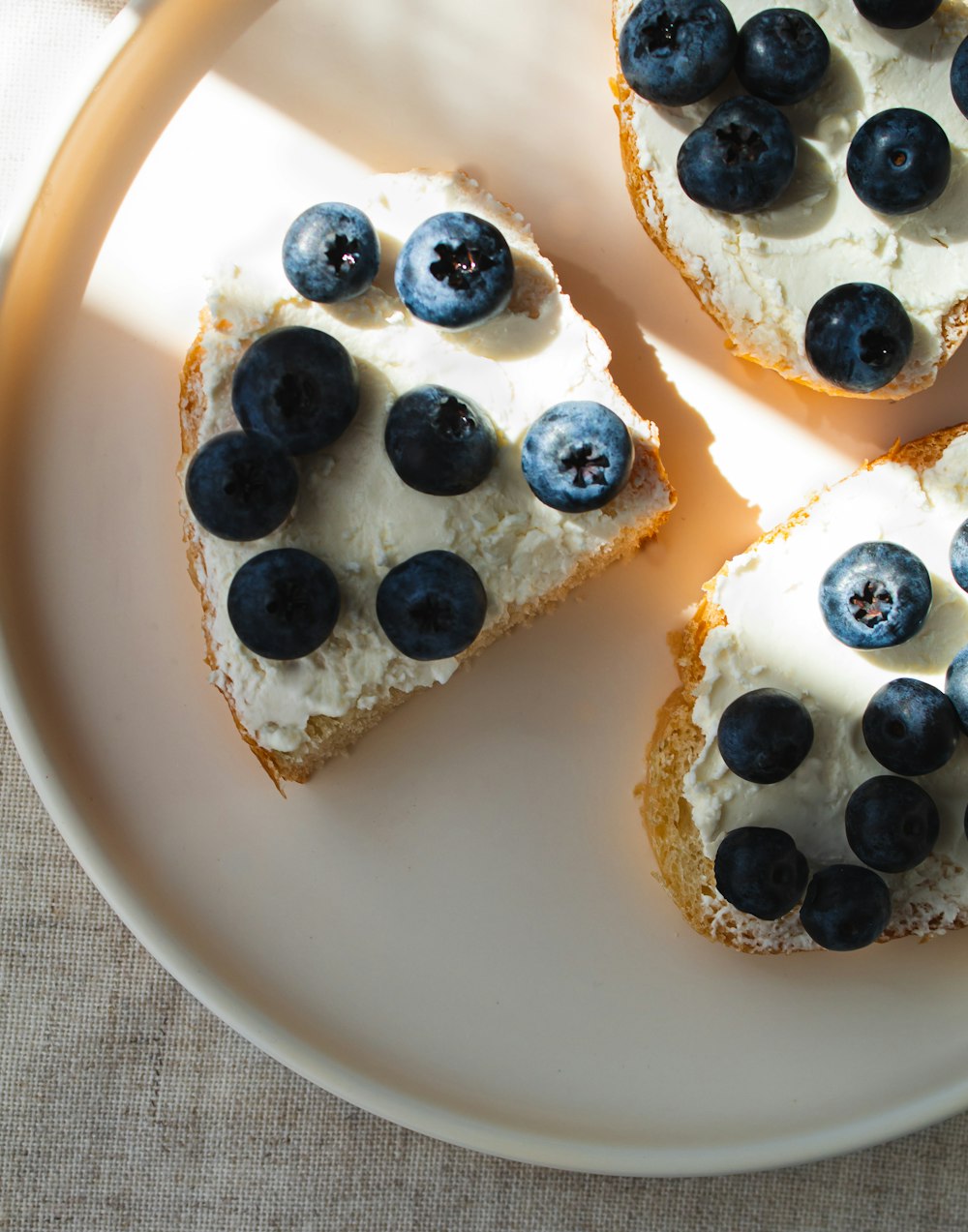 white ceramic bowl with blue berries