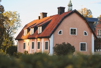 Cozy medium-value home featuring tasteful peach and earthy color palette with bright open spaces.
