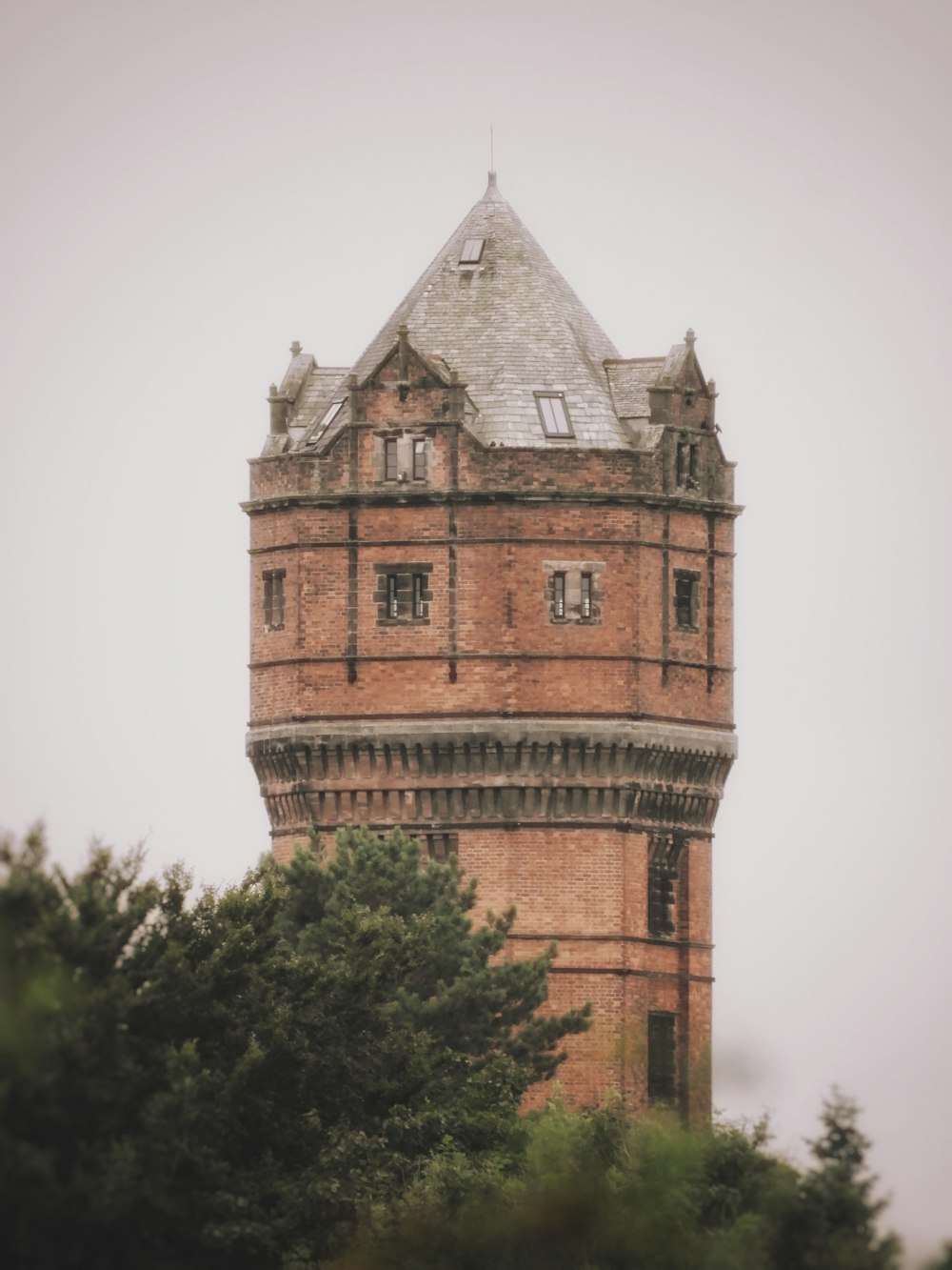 a tall tower with a clock on the top of it