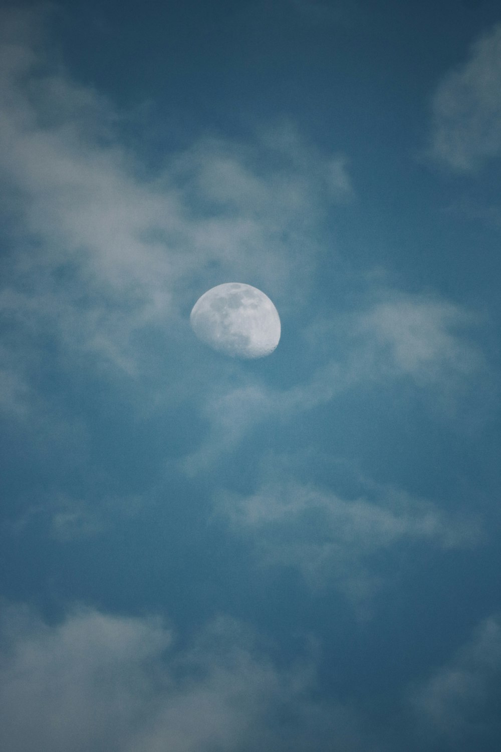 full moon in blue sky