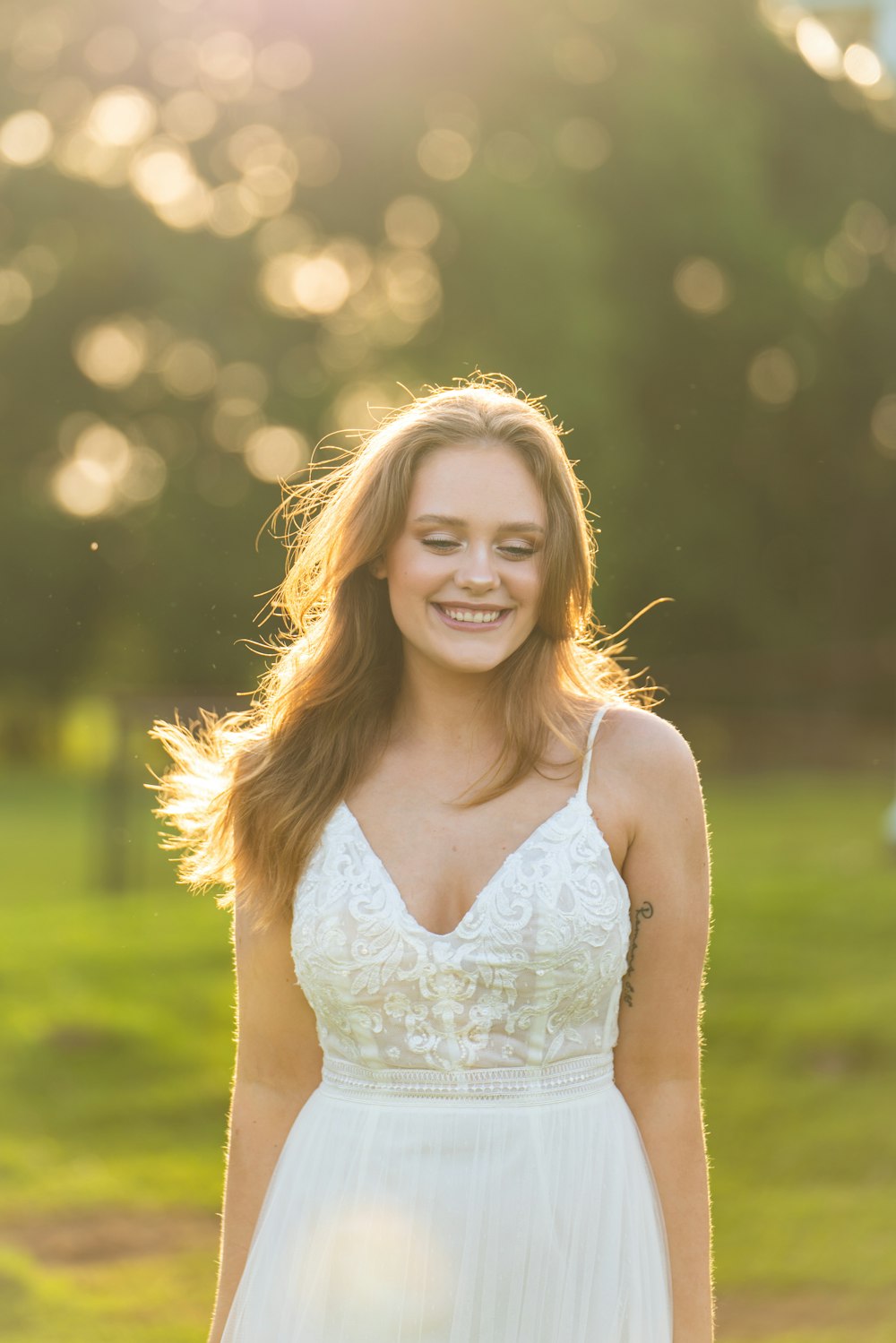 woman in white spaghetti strap top smiling photo – Free Image on Unsplash