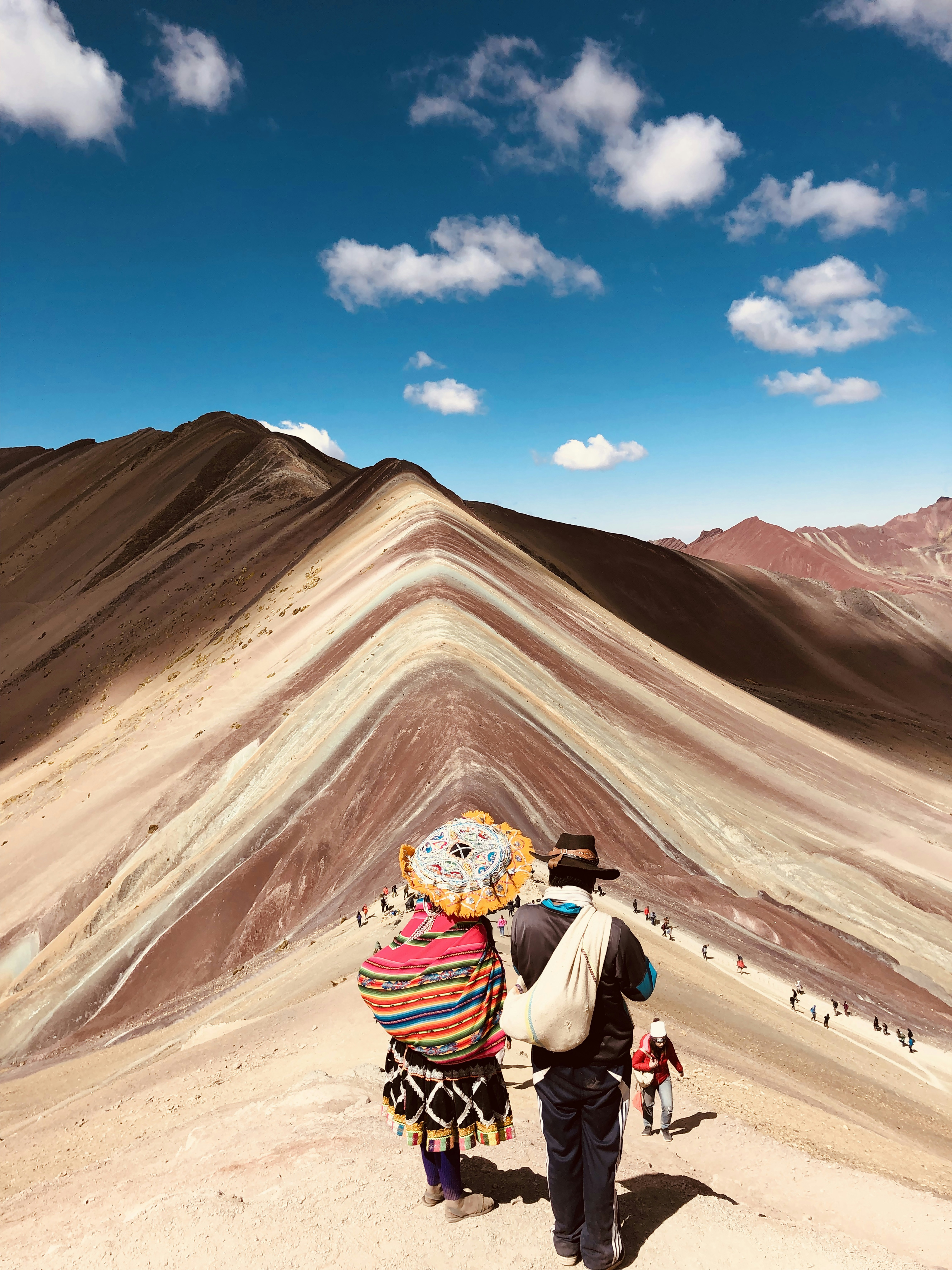a couple of people that are standing in the dirt