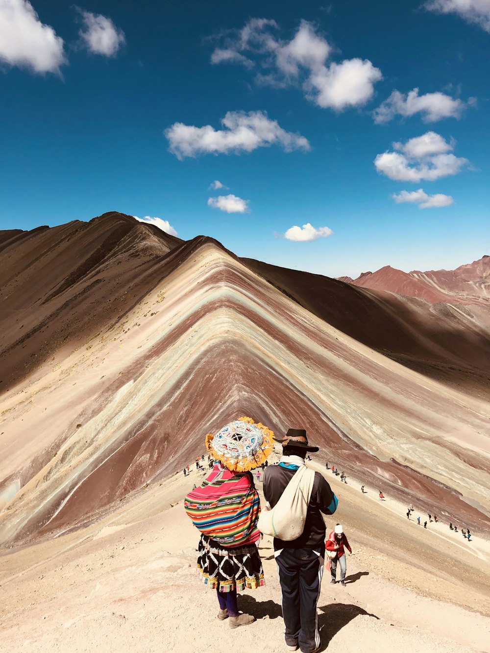 a couple of people that are standing in the dirt