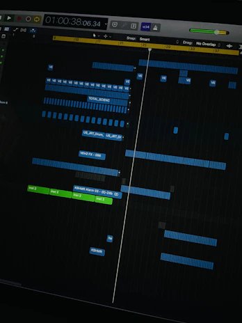 A colorful digital audio workstation screen displaying a layered music project in progress.