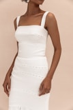woman in white spaghetti strap dress