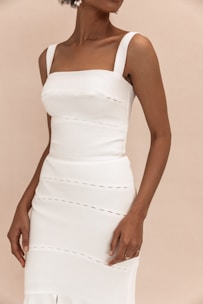 woman in white spaghetti strap dress