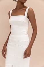 woman in white spaghetti strap dress