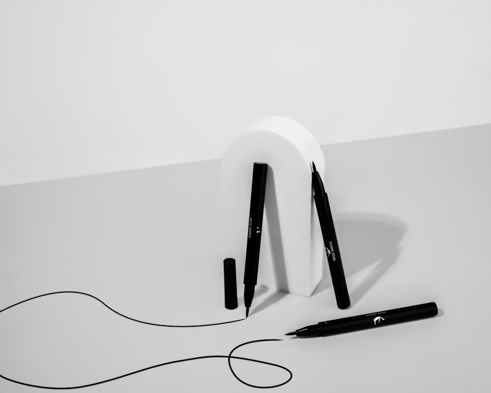 white and black wireless headphones