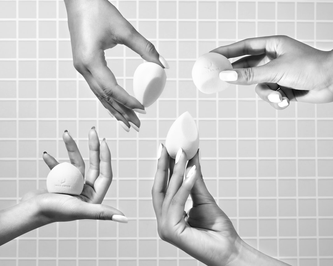 person holding white heart shaped ornament, MISS SWISS Marshmallow Sponges with hand models