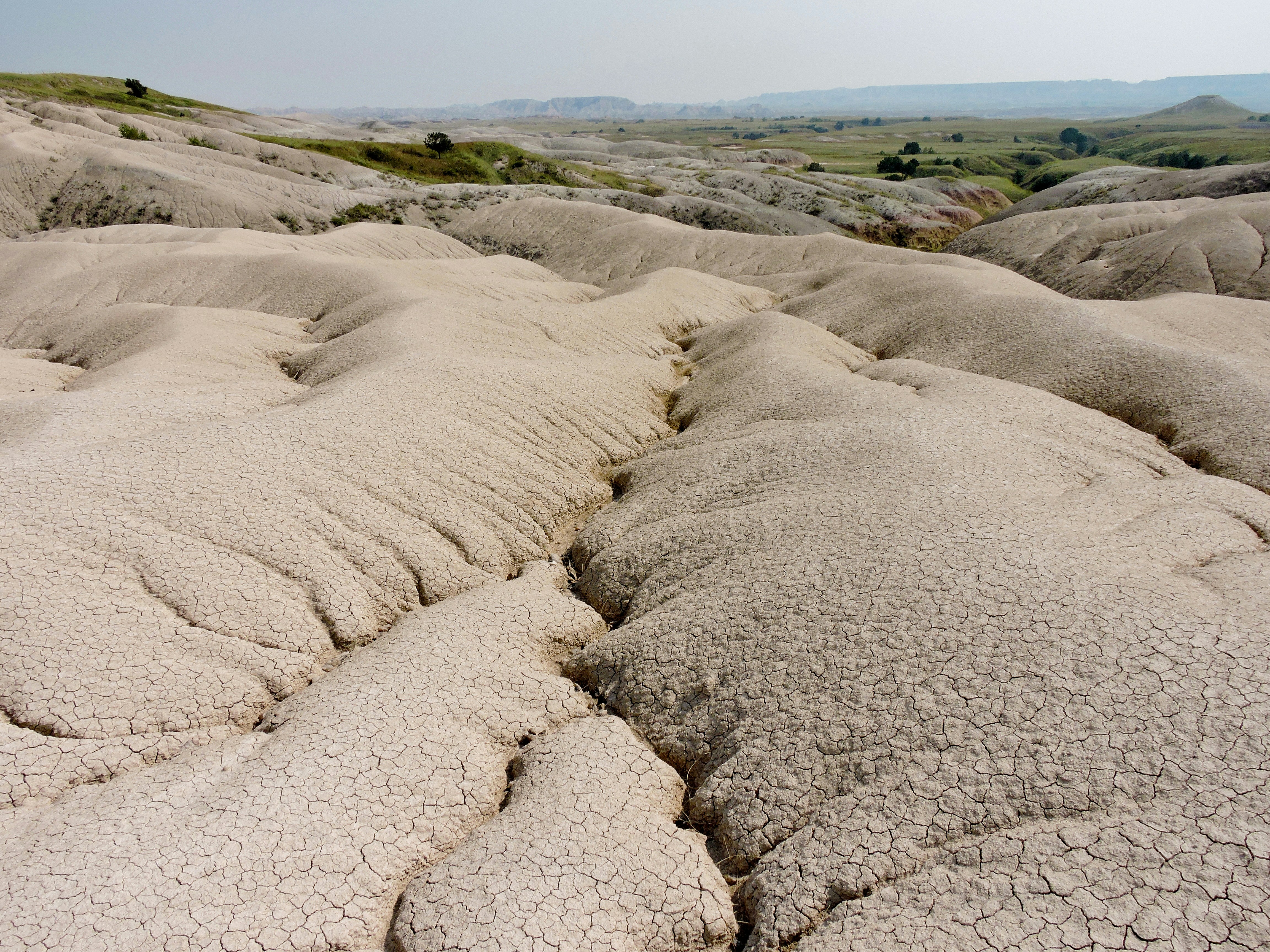 gray sand under white sky during daytime