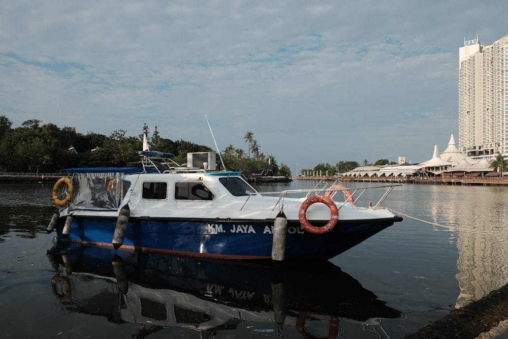 red and white boat on water during daytime