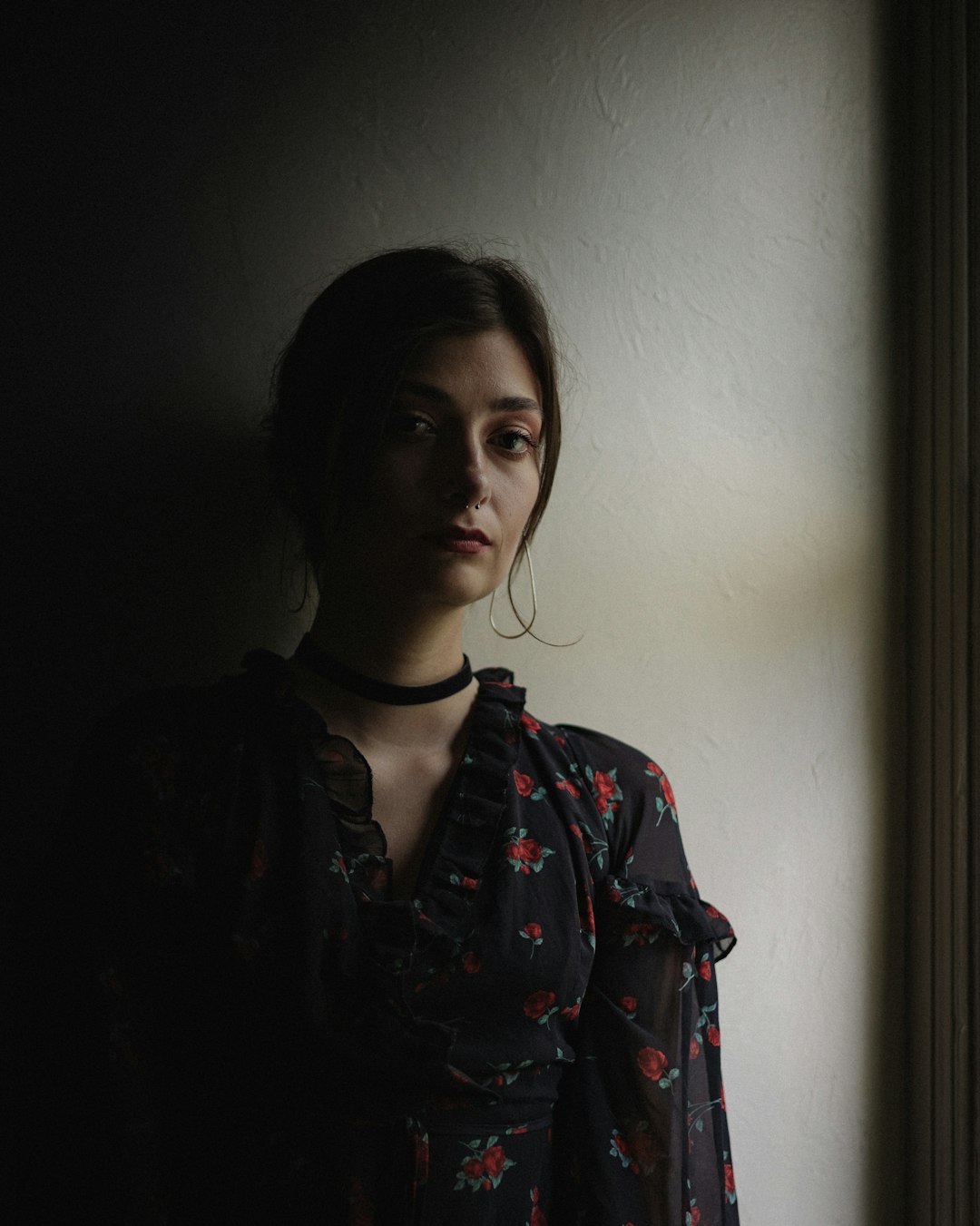 woman in black and red floral shirt