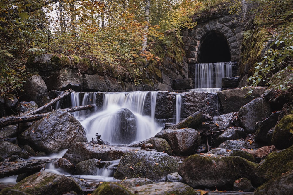 waterfalls in brown rock formation