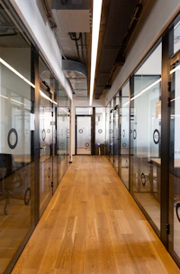 brown wooden floor and black metal doors