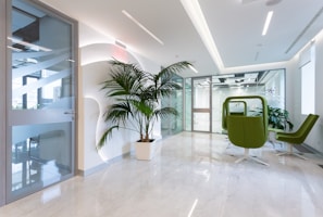 A commercial office space with polished floors and contemporary glass partitions.