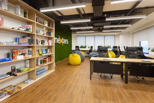 yellow round ottoman beside brown wooden shelf