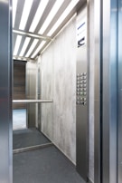 white wooden door with black metal door lever